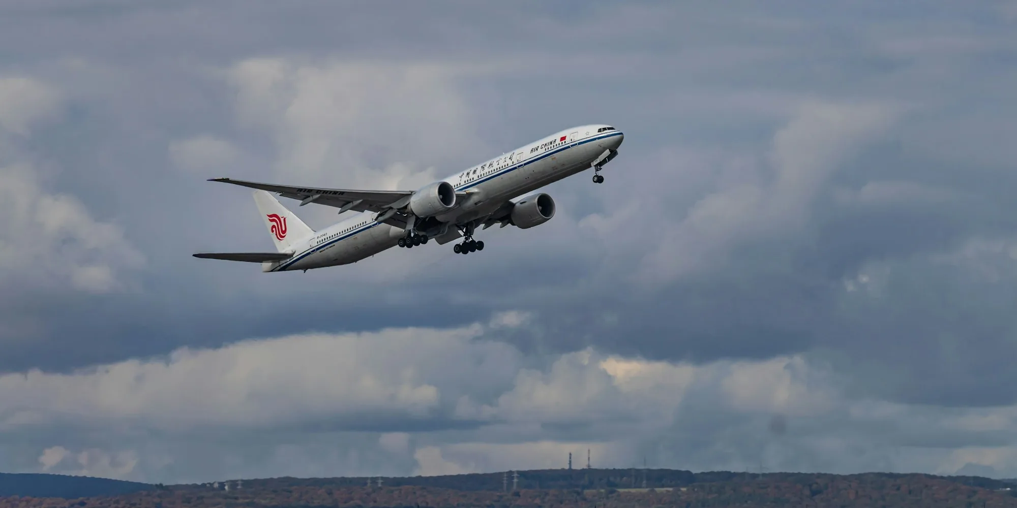 Commercial aircraft in flight against a clear sky